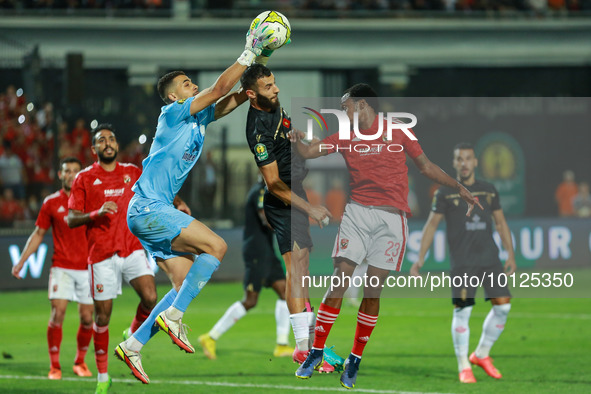 
Percy Tau of Al Ahly is in action against a player of Wydad during the CAF Champions League final playoff between Al Ahly and Wydad at Cai...