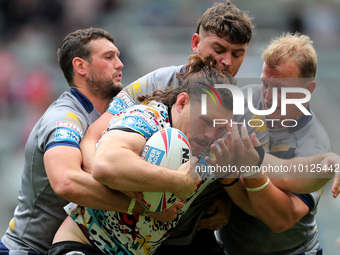 Robbie Mulhern of Leigh Leopards is tackled during the BetFred Super League match between Hull Football Club and Warrington Wolves at St. Ja...