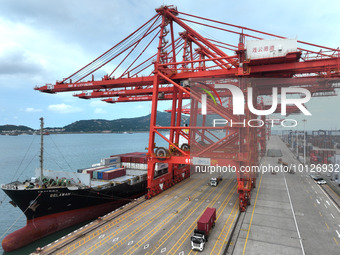 LIANYUNGANG, CHINA - JUNE 5, 2023 - Cargo ships stop at their berths to load and unload containers at the container terminal in Lianyungang...