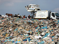 Palestinians collect plastic from a waste dump in Beit Lahia in the northern Gaza Strip, on June 5, 2023. June 5th is World Environment Day...