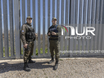 Greek border police officers patrol along the steel fence next to Evros river between Greece and Turkey to prevent unauthorized illegal entr...