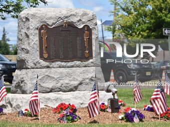 Veterans memorial with flowers and flags. U.S. Congressman Josh Gottheimer (NJ-5) joined with local veterans to announce and celebrate new i...