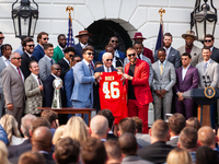 Kansas City Chiefs Patrick Mahomes and Travis Kelce present President Joe Biden with a personalized jersey during an event celebrating the t...