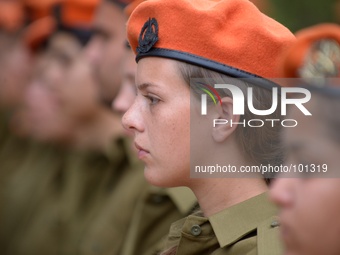 TEL AVIV, ISRAEL - MAY 05:An Israeli soldier attends the official Memorial day ceremony at the military cemetery Kiryat Shaul on May 5, 2014...
