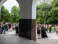 The funeral of Yulia Izotova in Slaviansk, Ukraine on May 5, 2014. Soon, hundreds more people had joined the funeral procession, causing the...