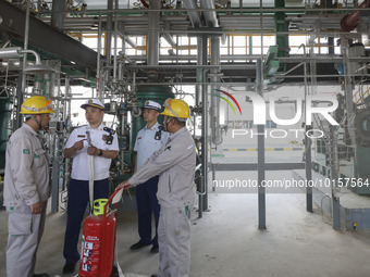 

Members of the emergency response team of a chemical enterprise are conducting a drill for plugging a leak in a pipeline in Huai'an City,...
