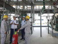 

Members of the emergency response team of a chemical enterprise are conducting a drill for plugging a leak in a pipeline in Huai'an City,...
