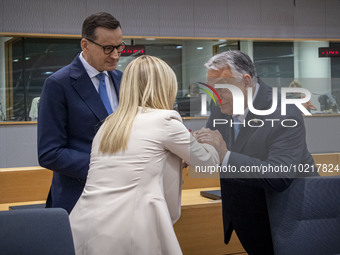 Prime Minister of Hungary Viktor Orban at the Tour de Table - Round Table seen kissing the hand of Giorgia Meloni PM of Italy next to Mateus...