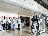 

Medical staff are using a lower limb rehabilitation robot to help patients recover in Chongqing, China, on July 4, 2023. (