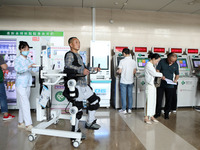 

Medical staff are using a lower limb rehabilitation robot to help patients recover in Chongqing, China, on July 4, 2023. (