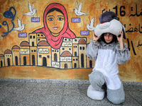 Palestinian children take part in a four-week summer activities programme organised in 83 schools in the Gaza Strip by the United Nations Re...