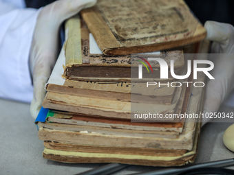 A group of Palestinian researchers from the ''Eyes on Heritage Foundation'', in Gaza City, are restoring and archiving ancient books and man...