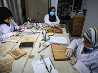 A group of Palestinian researchers from the ''Eyes on Heritage Foundation'', in Gaza City, are restoring and archiving ancient books and man...