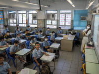 Students inside a classroom waiting for their teacher to distribute the result of their secondary school on July 11, 2023 in Hong Kong, Chin...