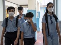 Students arriving at a school hall on July 11, 2023 in Hong Kong, China. Primary School Students today receive the results on their picks fo...