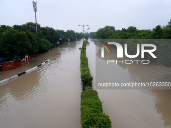 A view of a road showing both carriageways flooded due to the high-water level of the river Yamuna after heavy monsoon rains in New Delhi, I...