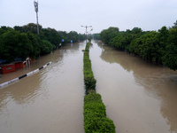 A view of a road showing both carriageways flooded due to the high-water level of the river Yamuna after heavy monsoon rains in New Delhi, I...