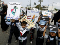 A Palestinians take part at a protest organized to mark the 66th anniversary of Nakba, and to condemn the international silence towards the...