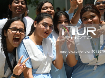 Students celebrate after receiving their Secondary School Certificate exam results in Dhaka, Bangladesh, on July 28, 2023


 (