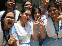 Students celebrate after receiving their Secondary School Certificate exam results in Dhaka, Bangladesh, on July 28, 2023


 (