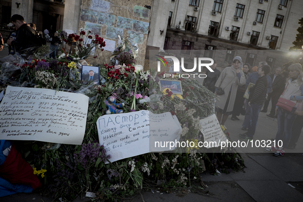 Flowers outside the burnt trade union building in Odessa, Ukraine, Wednesday May 7, 2014. More than 40 people died in the riots, which some...