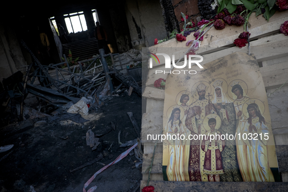 An religious icon outside the burnt trade union building in Odessa, Ukraine, Wednesday May 7, 2014. More than 40 people died in the riots, w...