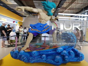 Citizens visit an exhibition at Changle Digital Education Town 101 Art Tide Play Center in Fuzhou, Fujian province, China, July 30, 2023. (