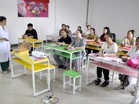 Women and children experts teach breastfeeding knowledge to expectant mothers in Zaozhuang, Shandong Province, China, August 4, 2023. (