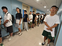 FUYANG, CHINA - AUGUST 8, 2023 - Young conscripts wait to take a medical examination for conscription in Fuyang city, Anhui province, China,...