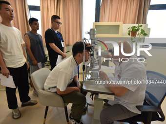 FUYANG, CHINA - AUGUST 8, 2023 - Young conscripts wait to take a medical examination for conscription in Fuyang city, Anhui province, China,...