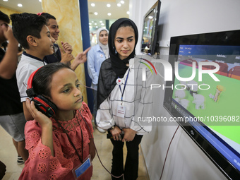 Palestinian students take part in a festival of the Science Days Palestine, at al Qattan Center in Gaza city on August 21, 2023. 
 (