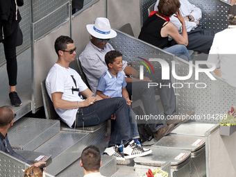 The Real Madrid player Cristiano Ronaldo attends with her son, tennis match of Rafa Nadal in the Mutua Madrid Open tennis tournament at the...