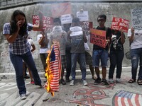 Protesters burn a mock US flag during a demonstration in Manila, Philippines, September 5, 2013. Protesters held a demonstration to condemn...