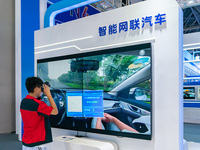  Citizens experience connected cars at the 2023 SMART CHINA EXPO in Chongqing, China, Sept. 5, 2023. (