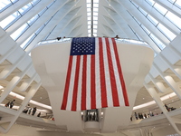 The Oculus at the World Trade Center is fill with crowds as U.S. flags from ceiling to commemorate the 9/11 Anniversary in New York, New Yor...