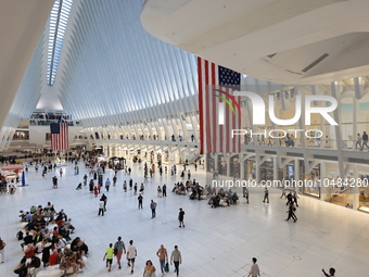 The Oculus at the World Trade Center is fill with crowds as U.S. flags from ceiling to commemorate the 9/11 Anniversary in New York, New Yor...