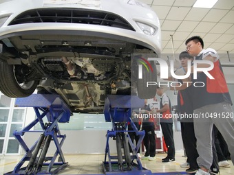 YANTAI, CHINA - SEPTEMBER 8, 2023 - Students conduct a training on vehicle maintenance at Yantai Vocational College of Culture and Tourism,...