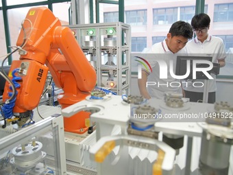 YANTAI, CHINA - SEPTEMBER 8, 2023 - Students conduct an industrial robot training at Yantai Cultural and Tourism Vocational College in Yanta...