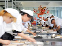 YANTAI, CHINA - SEPTEMBER 8, 2023 - Students have a cooking training at Yantai Vocational College of Culture and Tourism in East China's Sha...