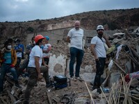 A foreign rescue team inspects the rubble of the houses destroyed by the earthquake in the remoted village of Imi N'Tala, located 75 kilomet...