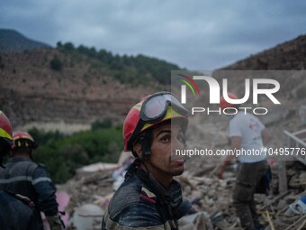 An exhausted member of the Moroccan civil protection, after digging in search of survivors in the remoted village of Imi N'Tala, located 75...