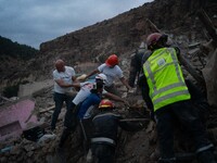 A foreign rescue team digs in search of survivors in the remote village of Imi N'Tala, located 75 kilometers southwest of Marrakesh. (