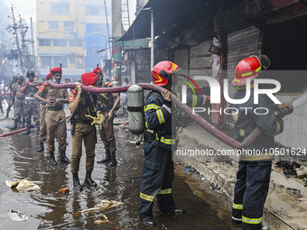 Firefighters try to extinguish a fire that broke out, at the Mohammadpur Krishi Market in Dhaka, Bangladesh, on September 14, 2023.
 (
