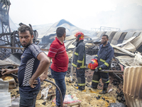 Firefighters stay  alart at Mohammadpur Krishi Market in Dhaka on September 14, 2023. A massive blaze has gutted shops in Dhaka's Mohammadpu...