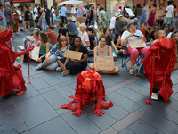 Red Rebels in front of the sit-in. Extinction Rebellion (XR) Toulouse organized a sit-in of women in one of the most frequented street of To...