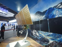 SHANGHAI, CHINA - SEPTEMBER 19, 2023 - Visitors look at a model of the Landsat 1 system at the 23rd China International Industry Fair 2023 i...