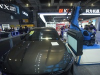 SHANGHAI, CHINA - SEPTEMBER 19, 2023 - Visitors watch an AI vision robot perform defect detection on a car surface at the 23rd China Interna...