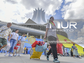 NANNING, CHINA - SEPTEMBER 19, 2023 - People walk out of the venue of the ASEAN Expo with purchased goods in Nanning, Guangxi province, Chin...