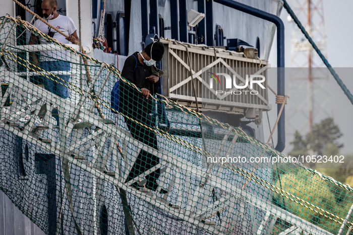 A migrant disembark from MSF's (Doctors Without Borders) Geo Barents ship at the Italian port of Brindisi on September 19, 2023. The ship ca...