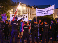 People demonstrate holding banners during an anti-government protest in Krakow, Poland on September 18, 2023. Protestors organized a rally a...
